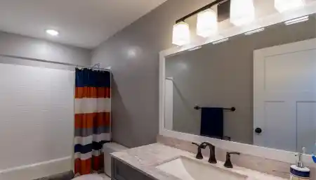 Colorful bathroom with patterned shower curtain